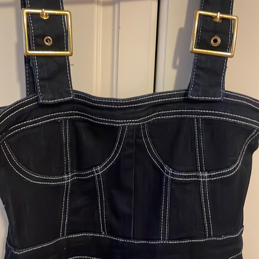 We wore what denim pantsuit with overall grommet style sleeves